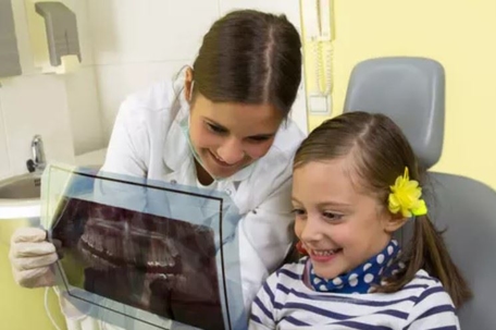 Dentist looking at an x-ray