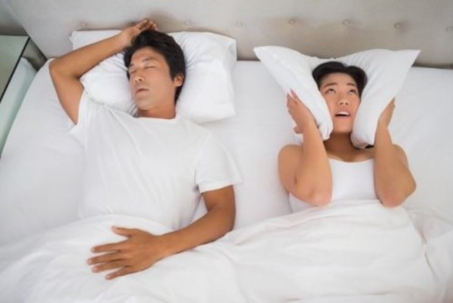 man and woman in bed