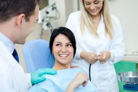 woman getting her  teeth cleaned