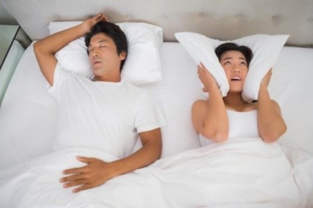 man and woman in bed