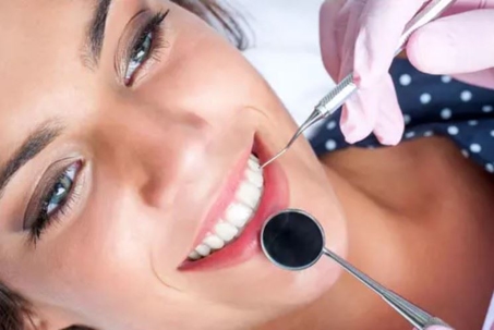 woman getting her  teeth cleaned